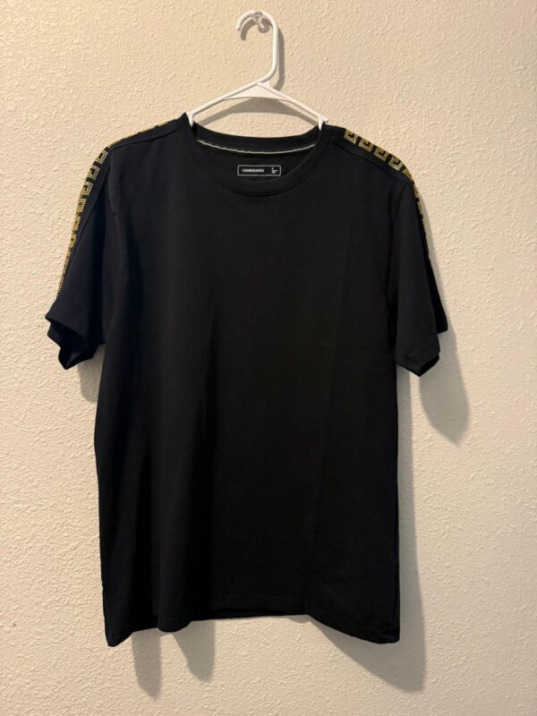 Black Conscience T‑Shirt with Gold Shoulder Trim